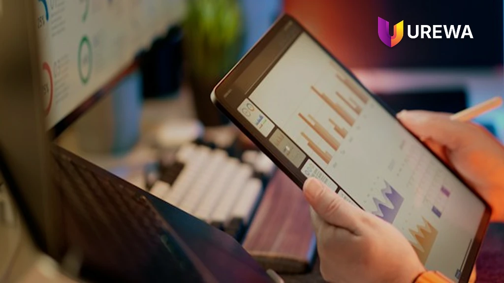 An operations team member checking integration monitoring charts on a tablet, tracking message volumes, transaction status and failed interfaces between Dynamics 365 and connected business applications